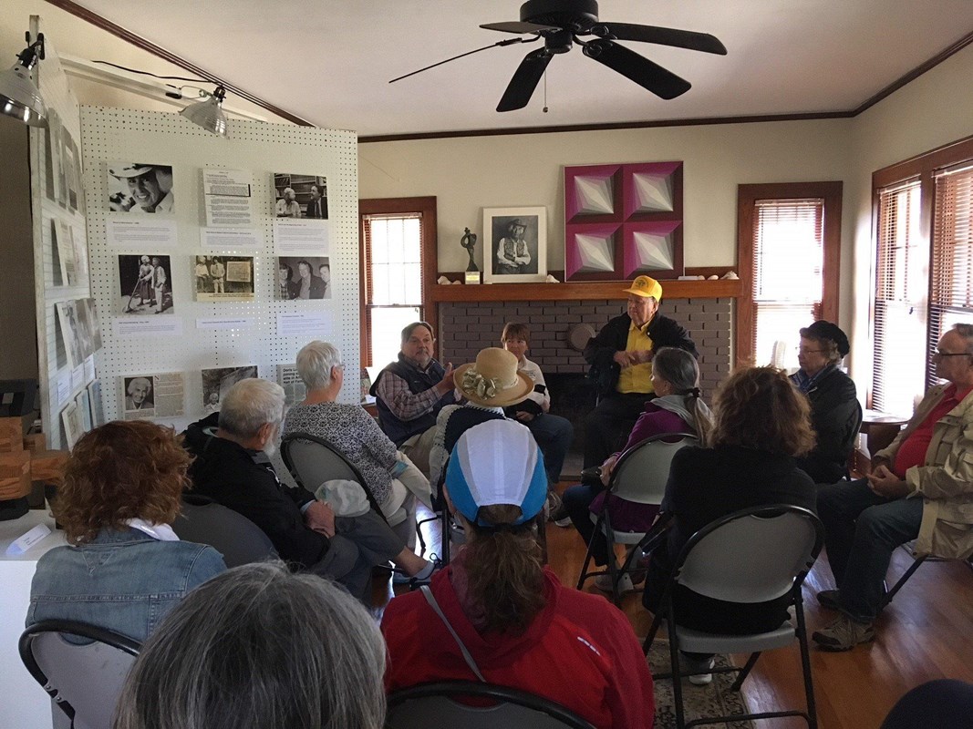 Visitors inside the Doris Leeper house during an exhibition.