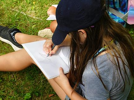 a girl writing in a book