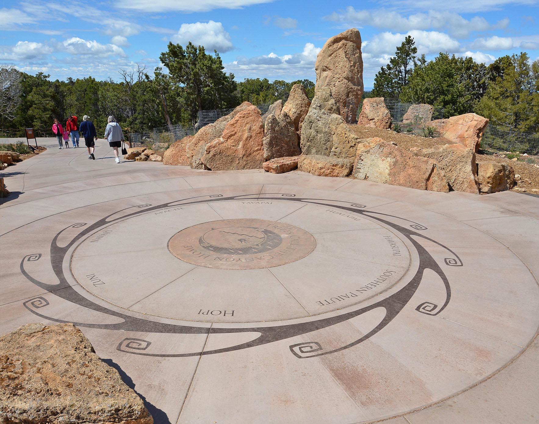 in an open area, a large circle with the names of Native American Tribes is set into the concrete.