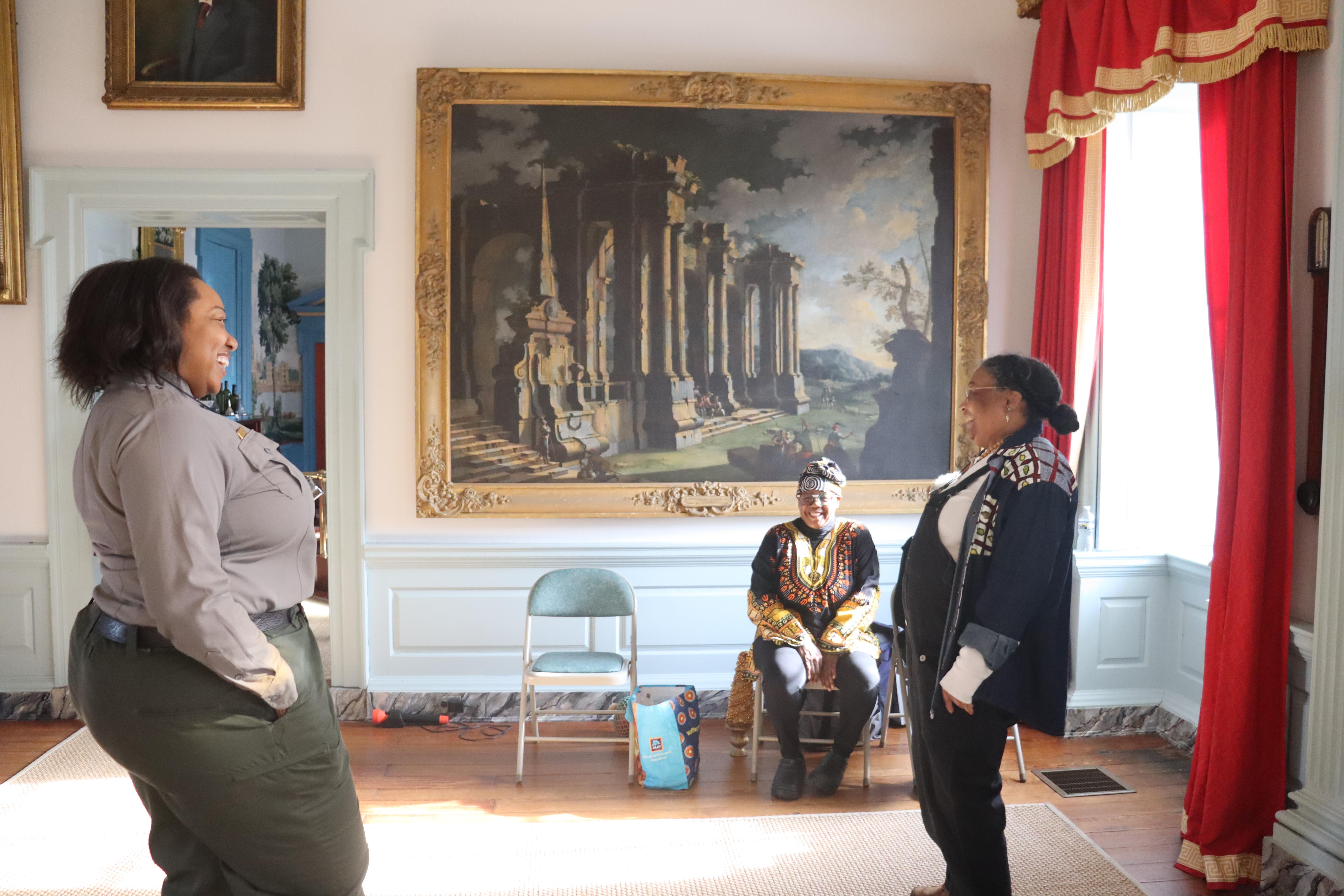 Park Ranger talking to visitors on a tour of the mansion
