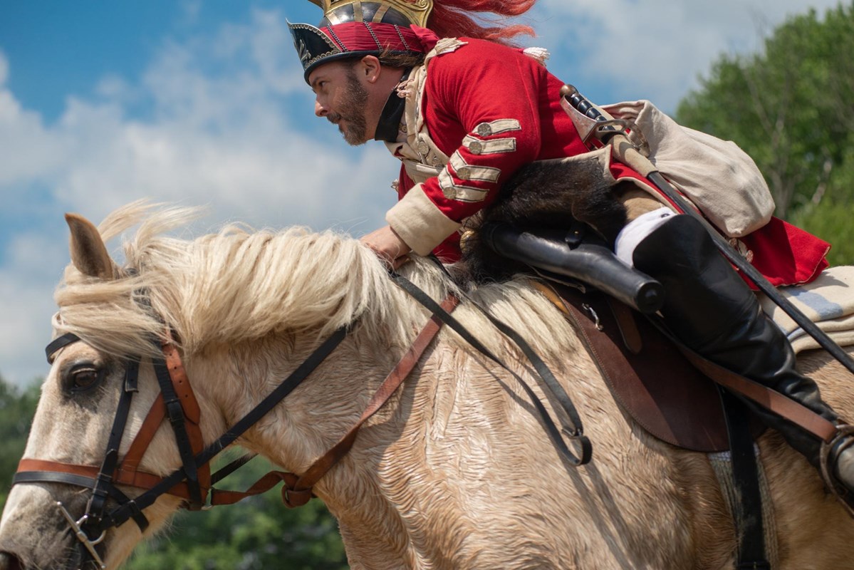 Reenactor riding a horse during the Rendezvous