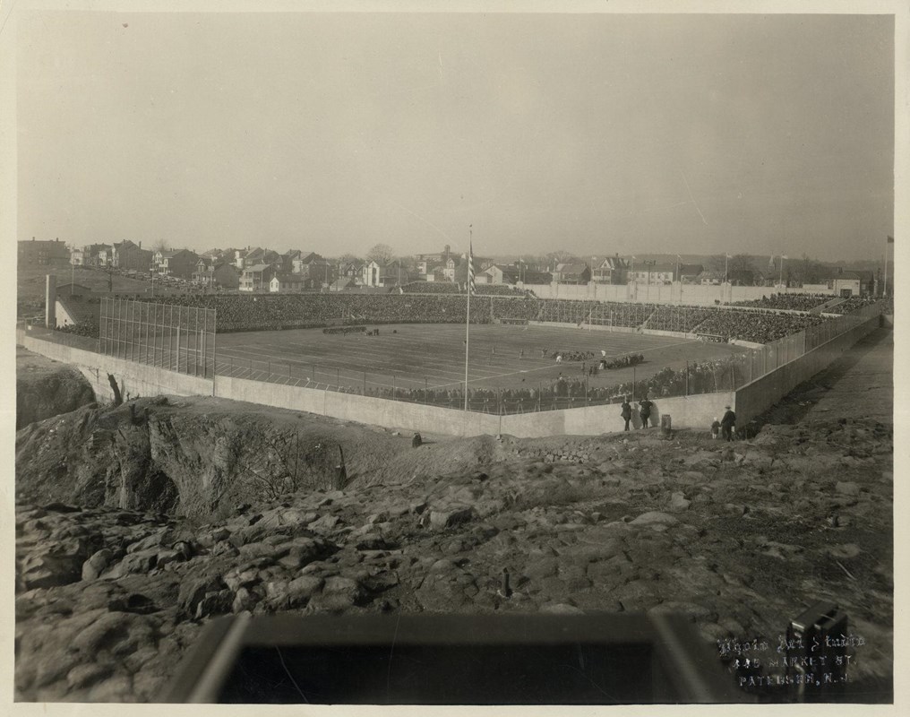 Historic black and white photo of Hinchliffe Stadium taken from an above and behind view.
