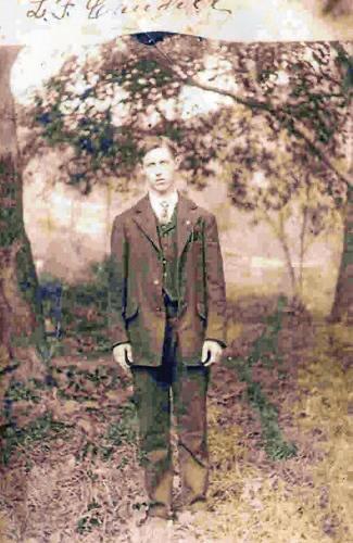 Lenny Famon Caudill standing amongst trees