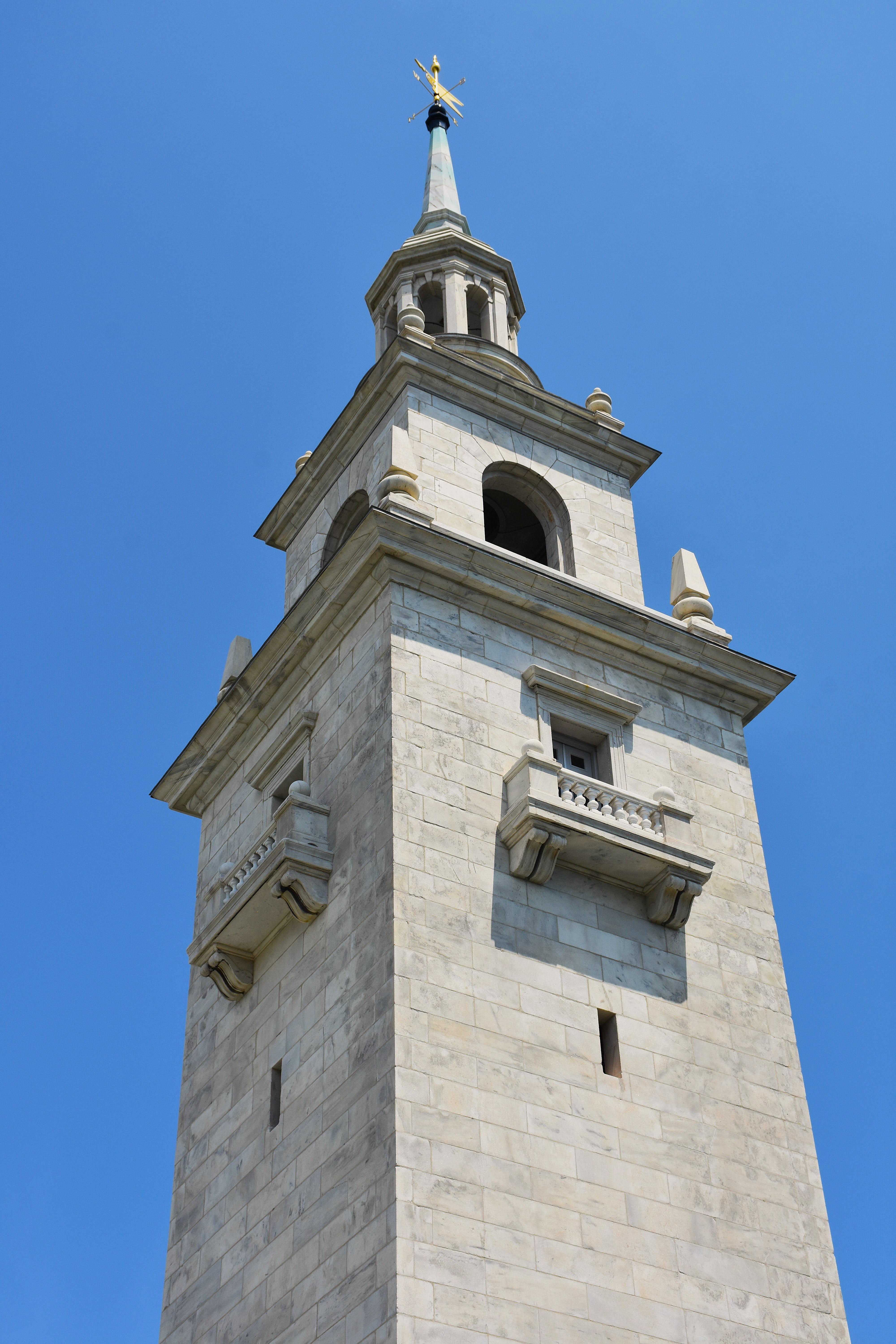 View up to the top of the Dorchester Heights Monument, a steeple looking monument.