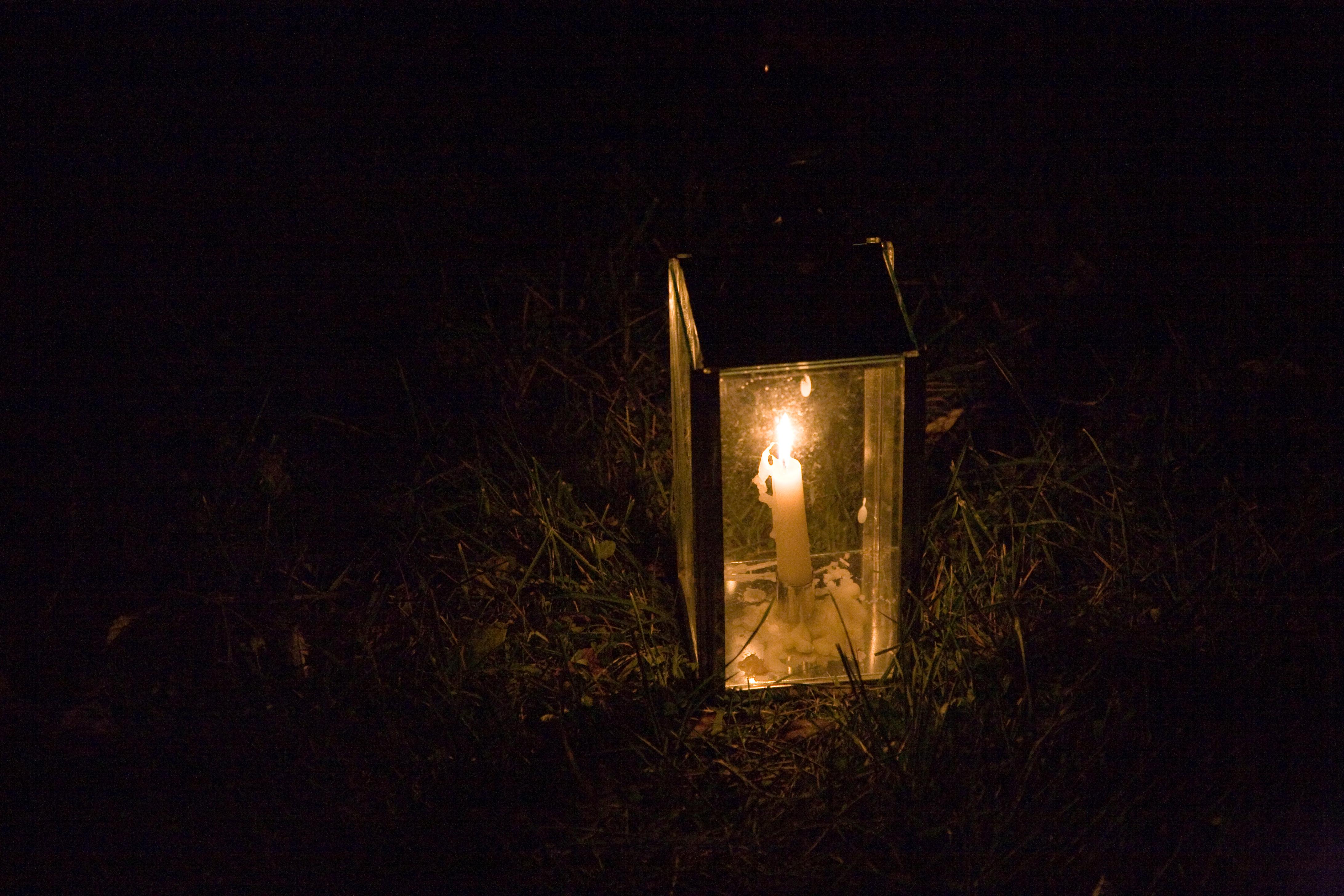 Vintage style lantern lit up at night.