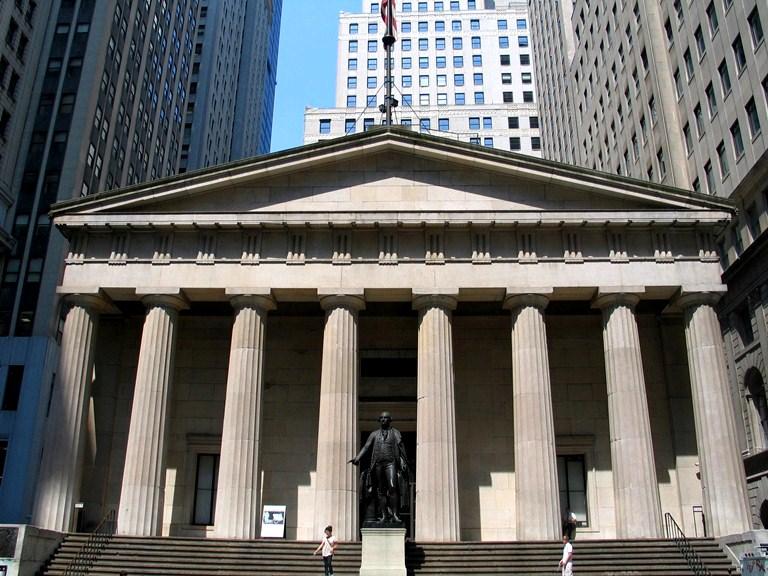 Federal Hall, a gray stone building with columns.