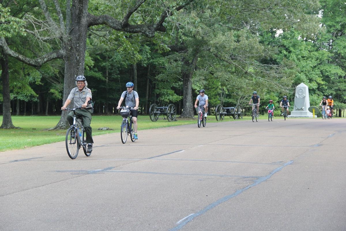 Park ranger leading a bicycle tour.