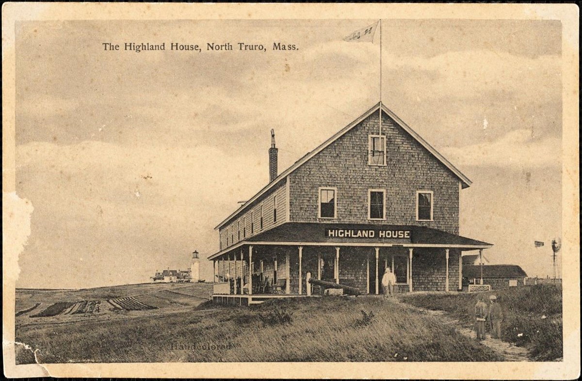 Historic postcard image of large wood-shingled hotel