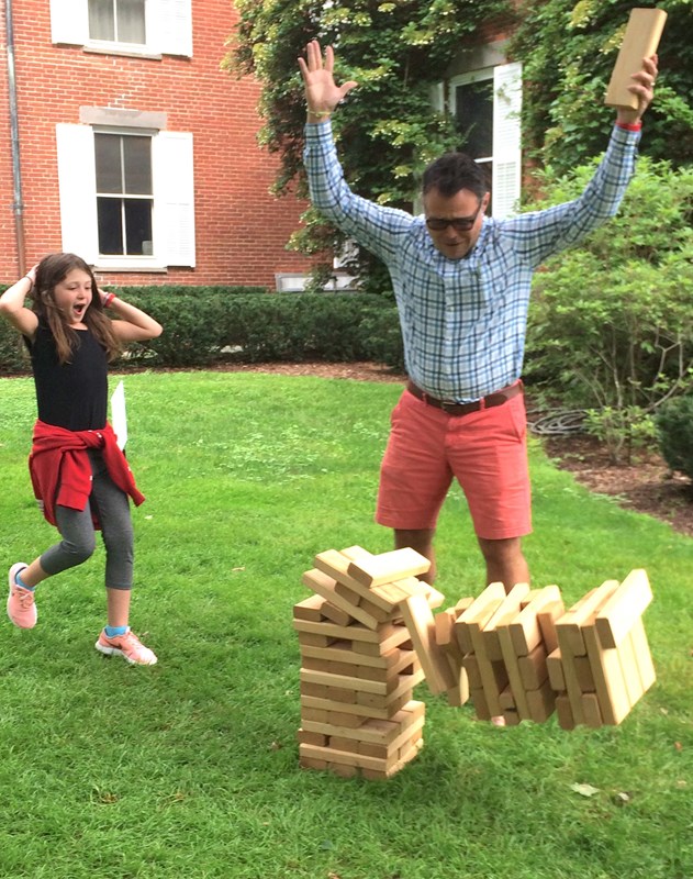 family enjoying lawn games