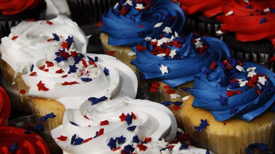 Cupcakes with red, white, or blue frosting, and red, white, and blue star-shaped sprinkles