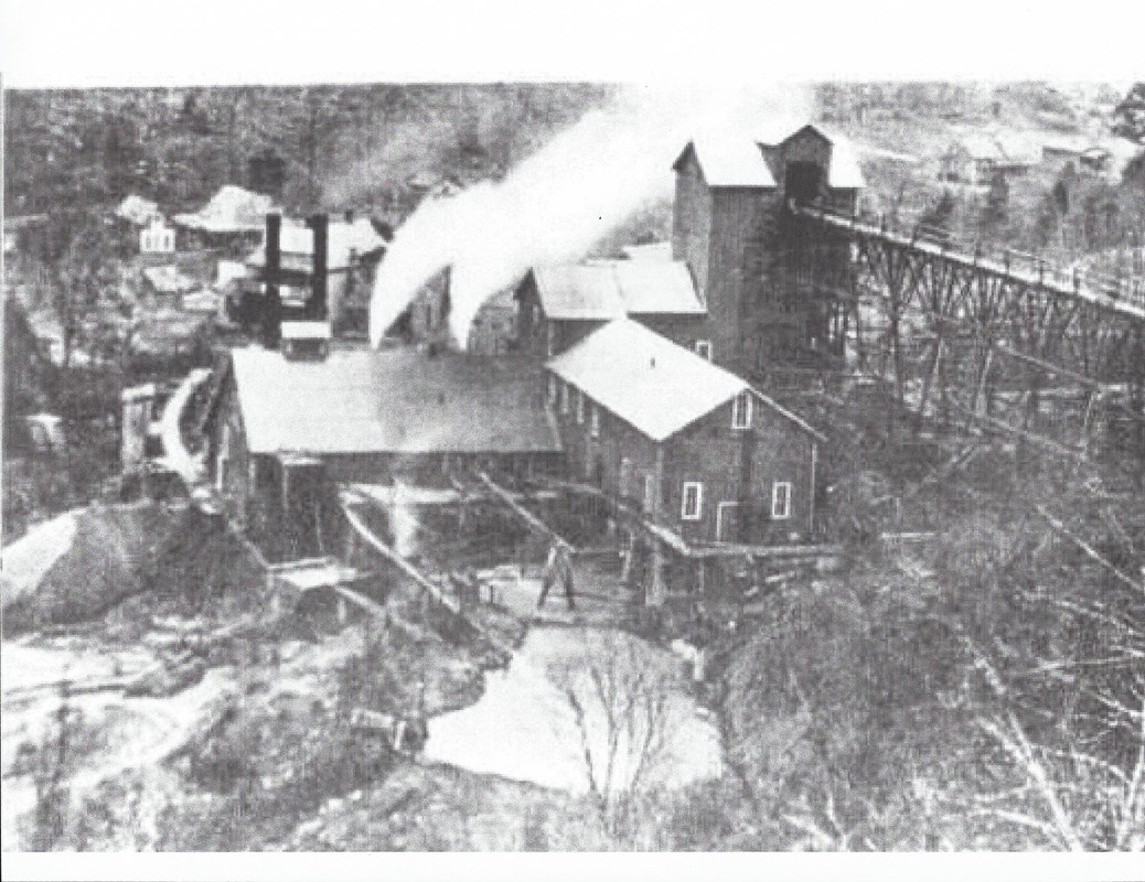A black and white photo of a mining facility in operation at Rush, Arkansas
