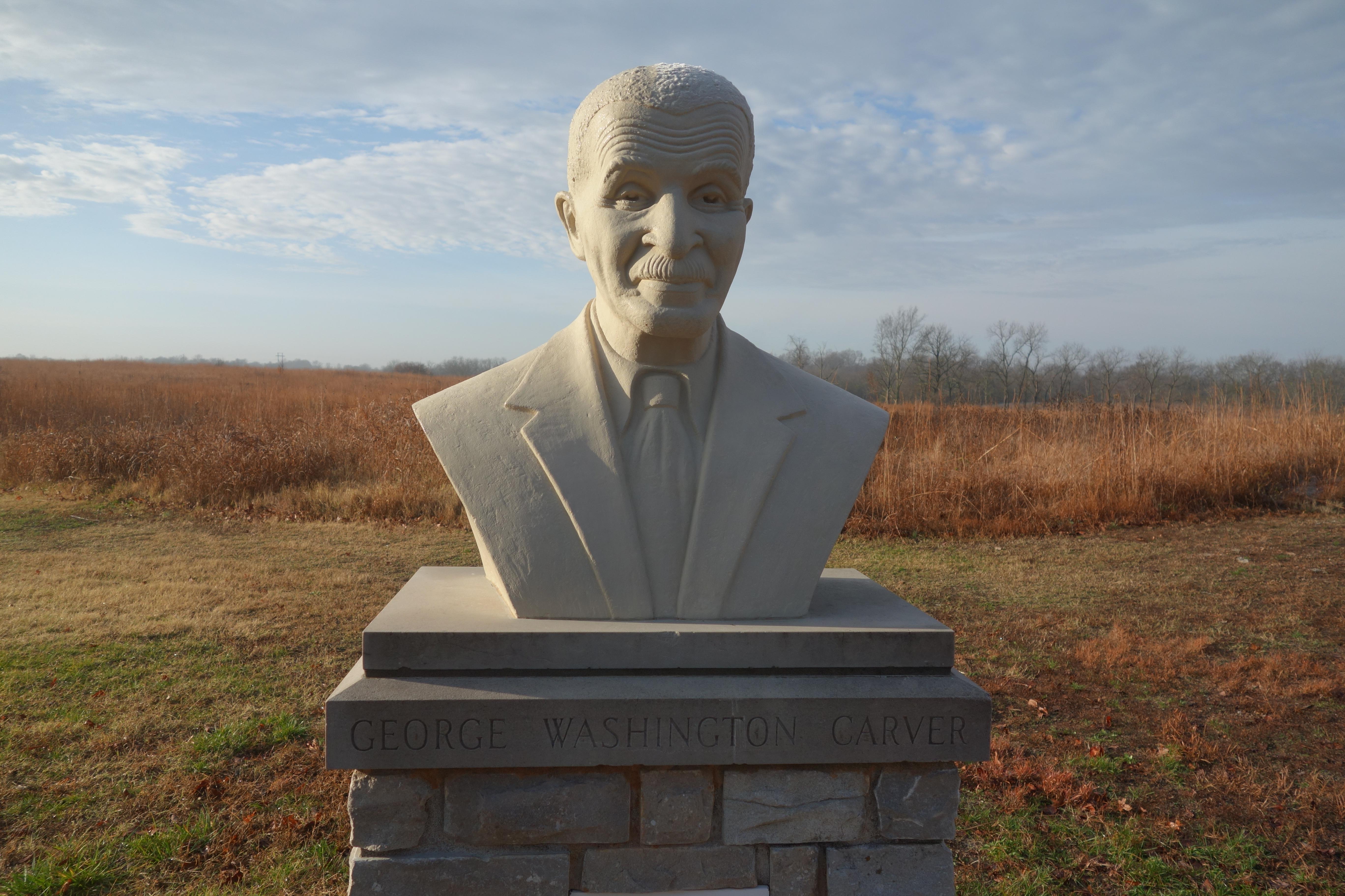 Concrete bust of George Washington Carver.