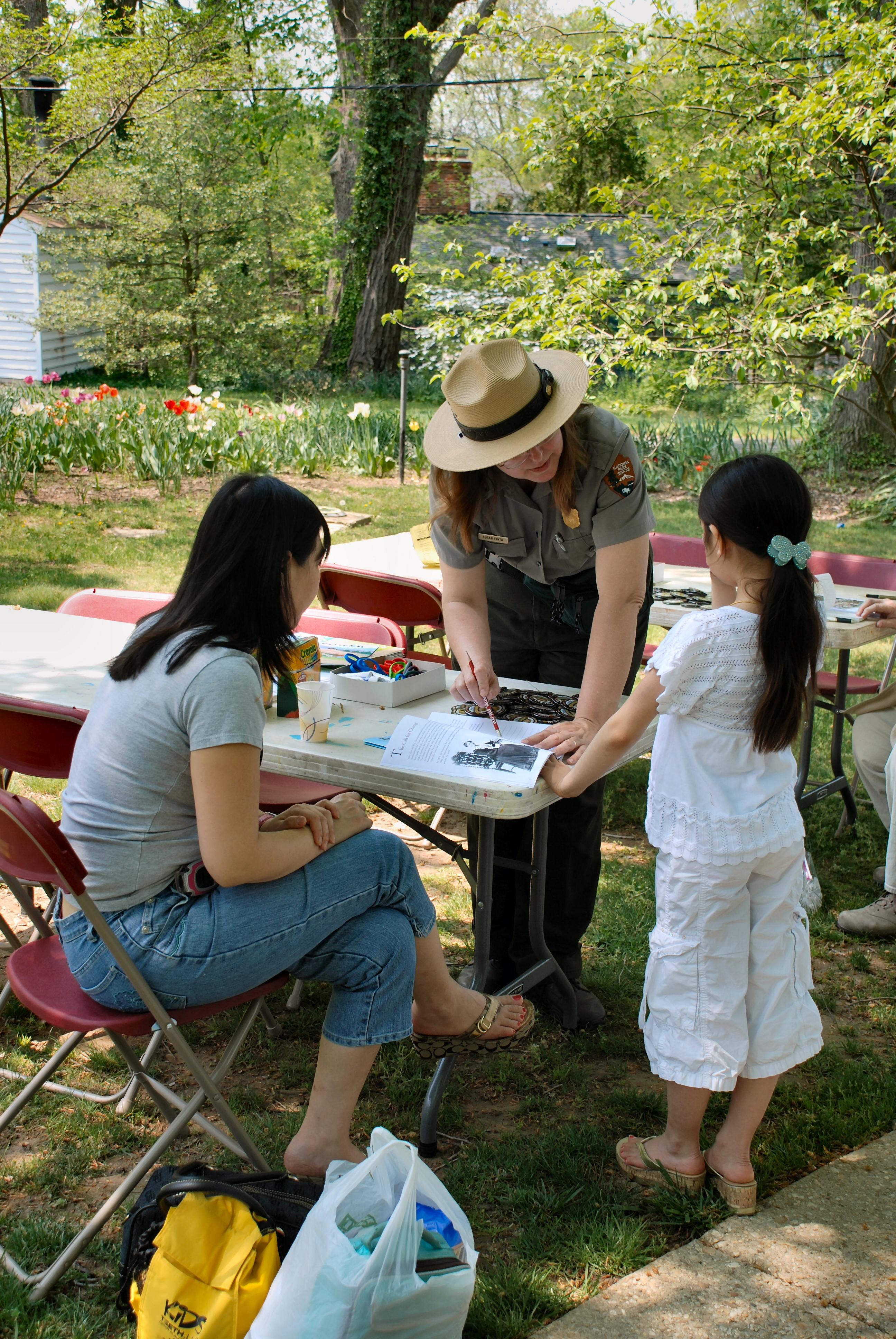Park Rangers conducting a junior ranger event.