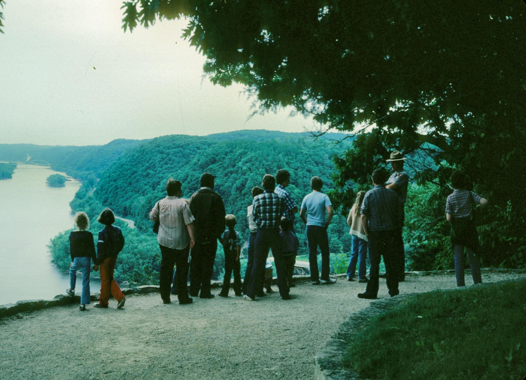 image of a park ranger engaging with a group of visitors at an overlook.