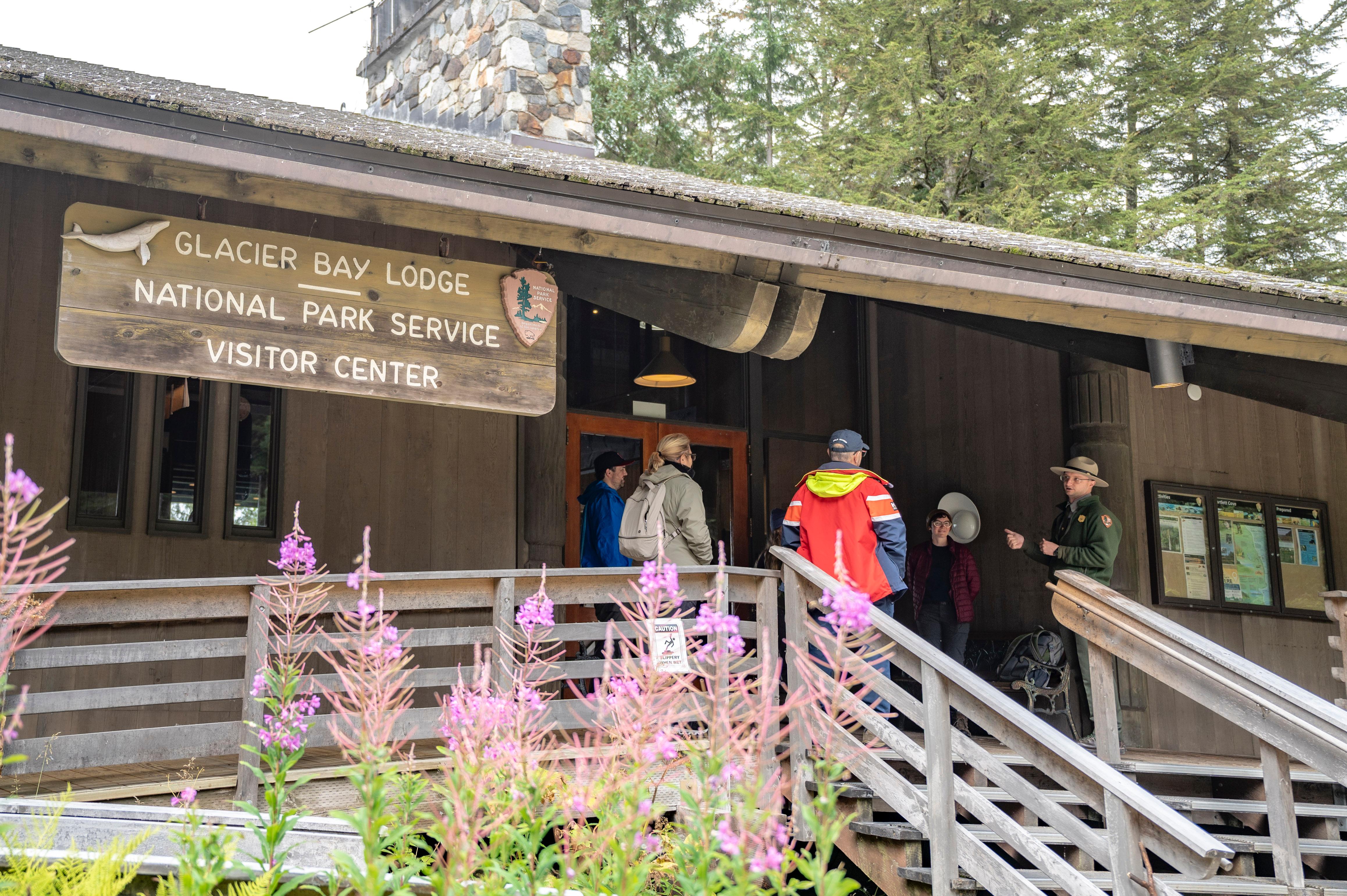 Park Ranger speaks to guests on the front porch of the Glacier Bay Lodge.
