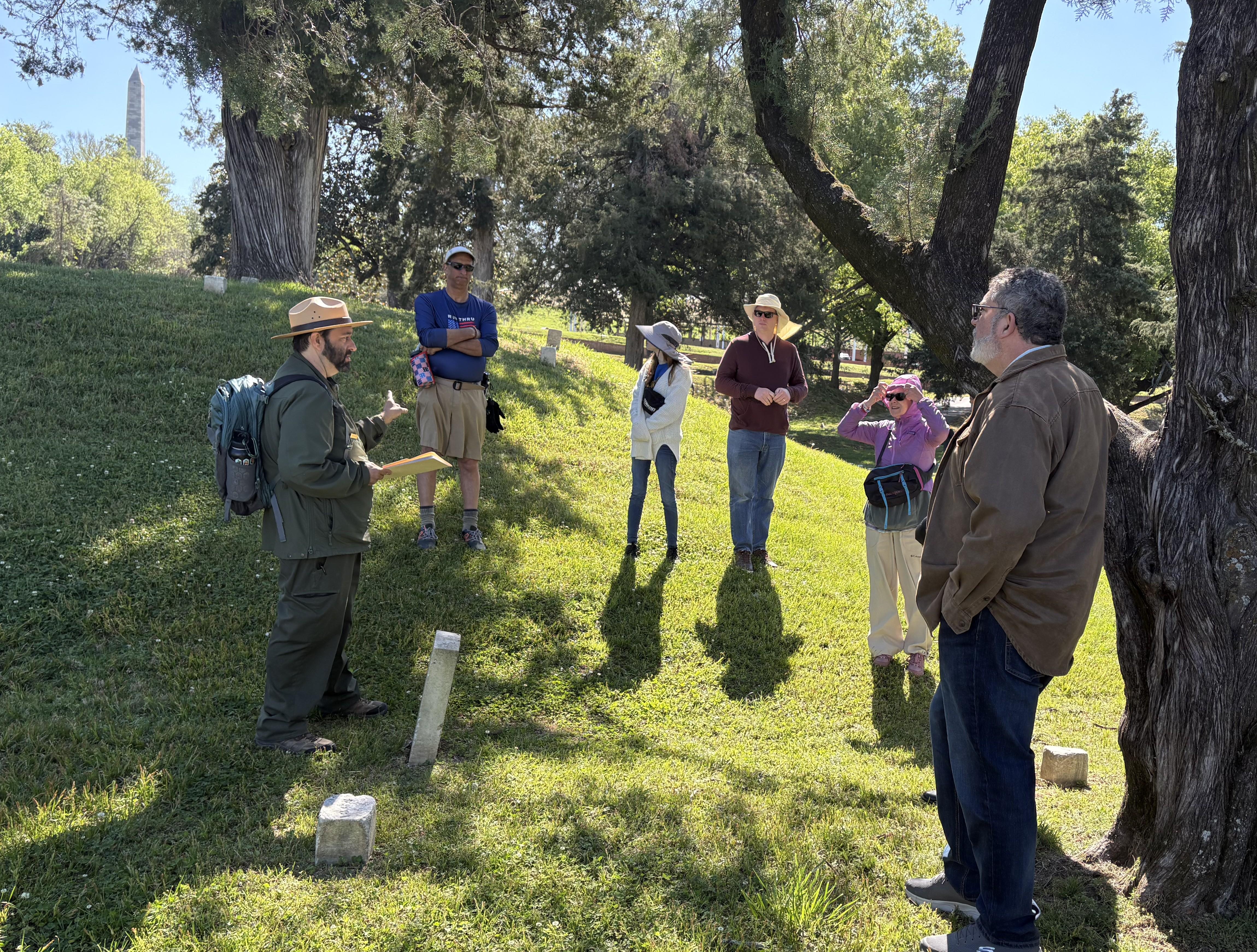 Ranger talks to visitors in the National Cemetery