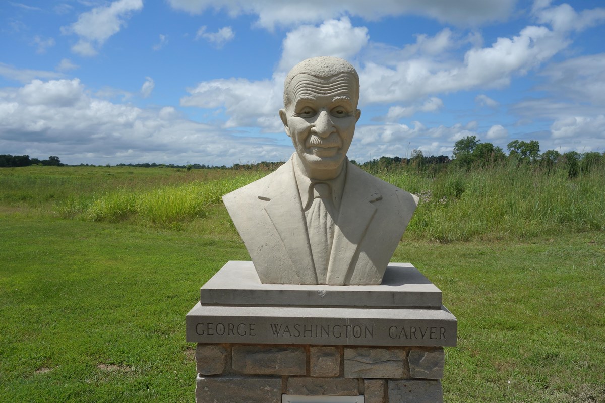 Cast concrete bust of George Washington Carver.