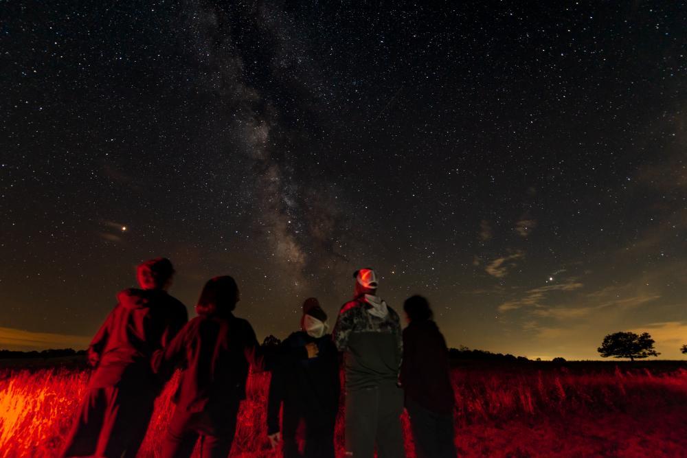 A group of visitors observe the Milky Way in Big Meadows.