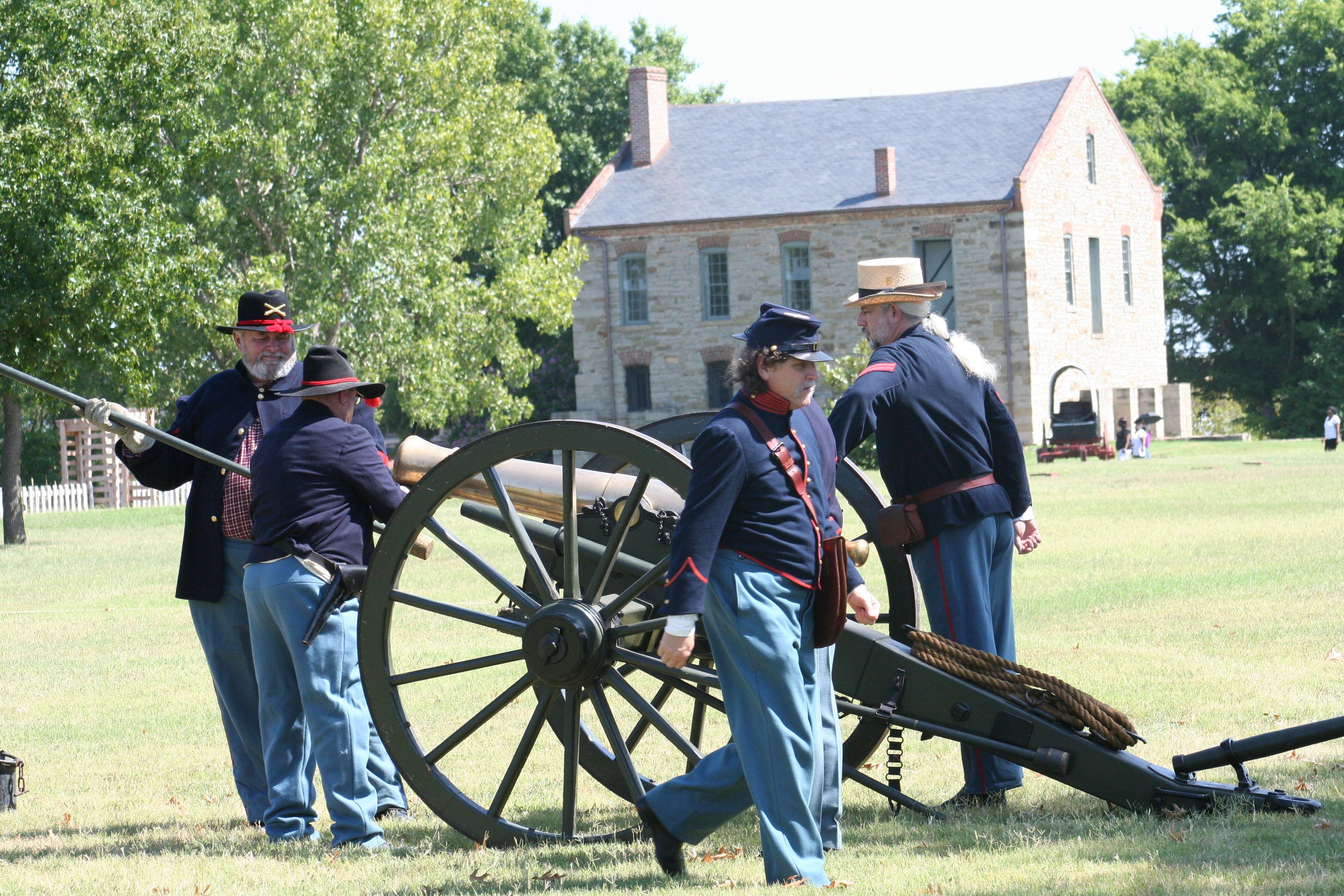 Union Civil War reenactors load a cannon during a demonstration.