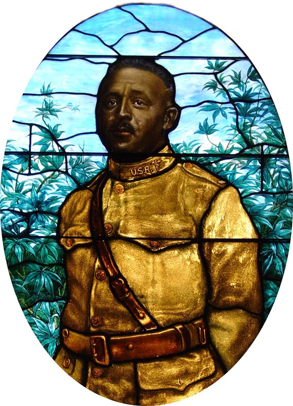 Stained glass window depicting the likeness of Urbane Bass in his WWI military uniform.