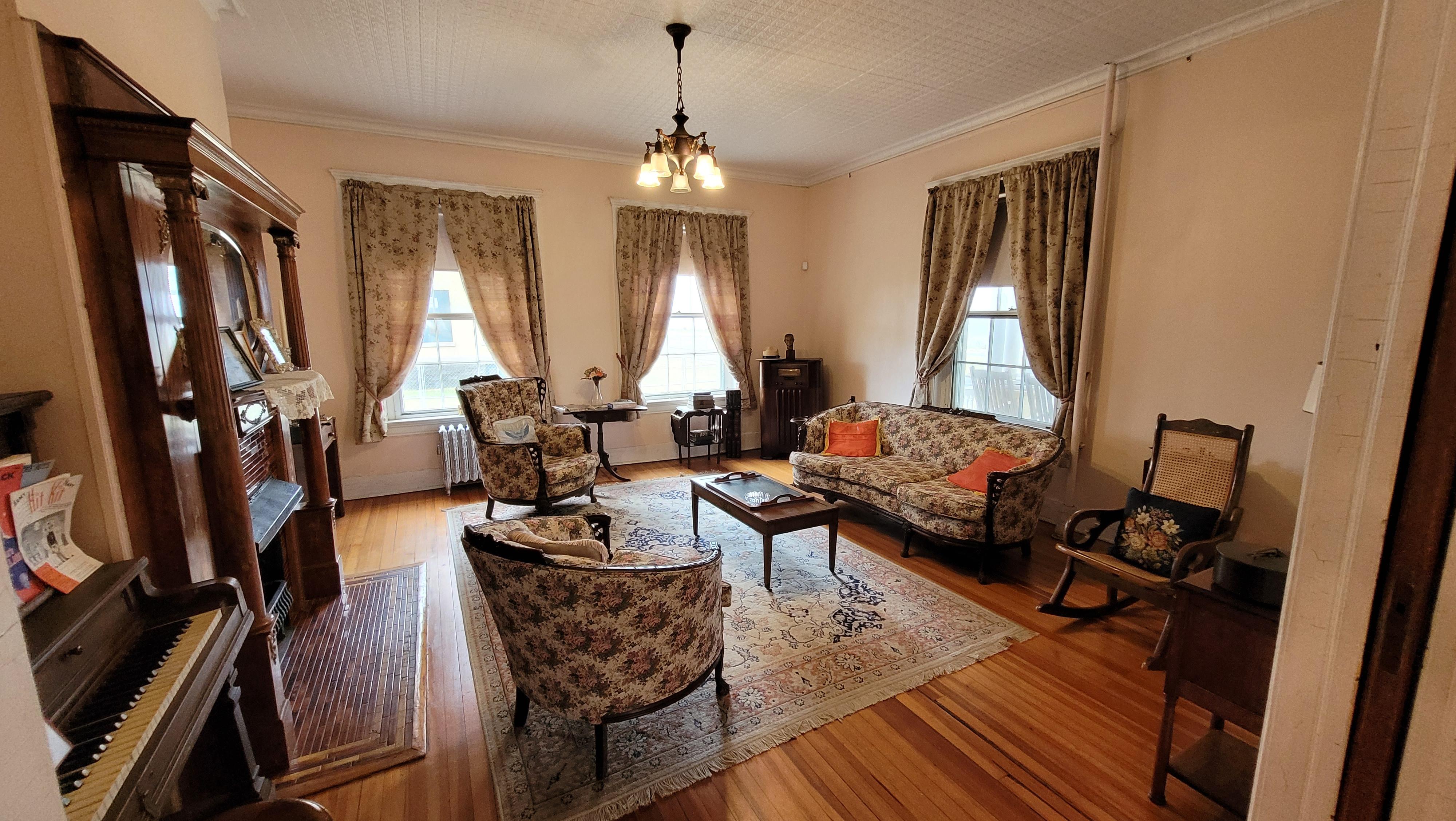 Parlor of historic house decorated as if in the mid-1940s