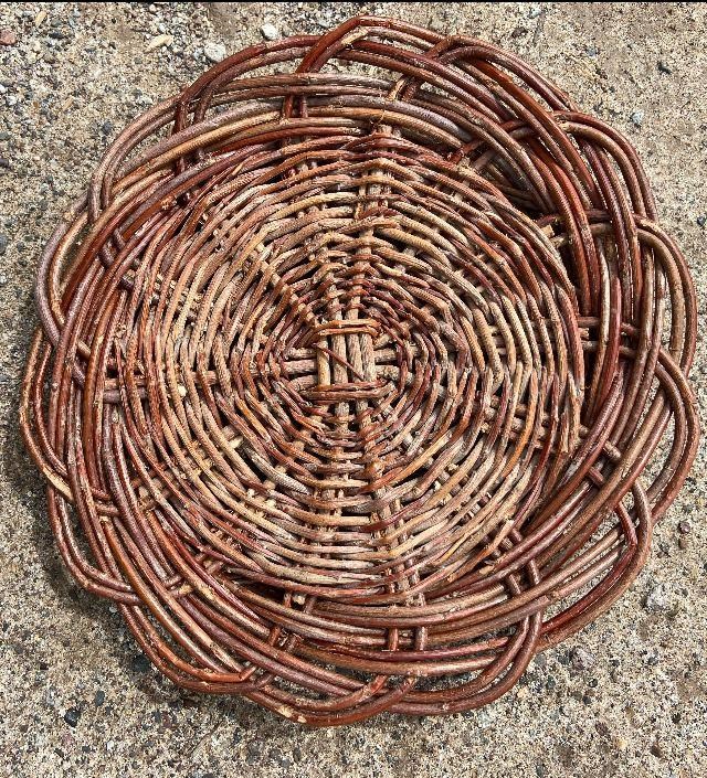 A basket made by Andrew Harvier in the style that workshop participants will learn to weave in.