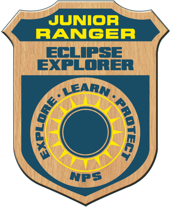 A junior ranger badge reading Eclipse explorer, explore, learn, protect, NPS and an image of the Sun