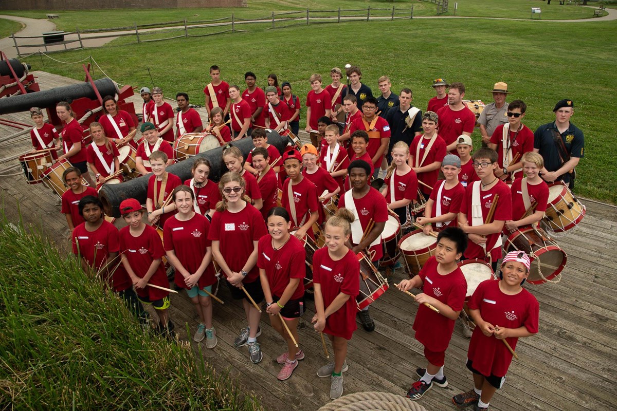 a group of fife and drum campers on the water battery.