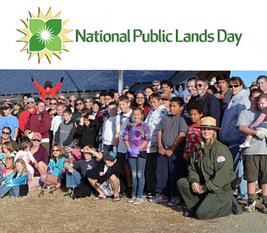A group of kids and park ranger with the NPLD logo above.