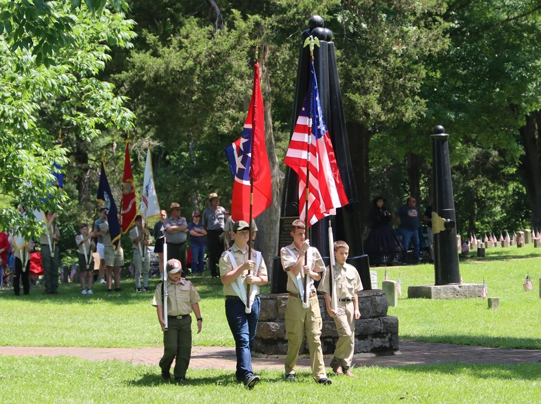 Boy Scouts carry flags as part of the honor guard.