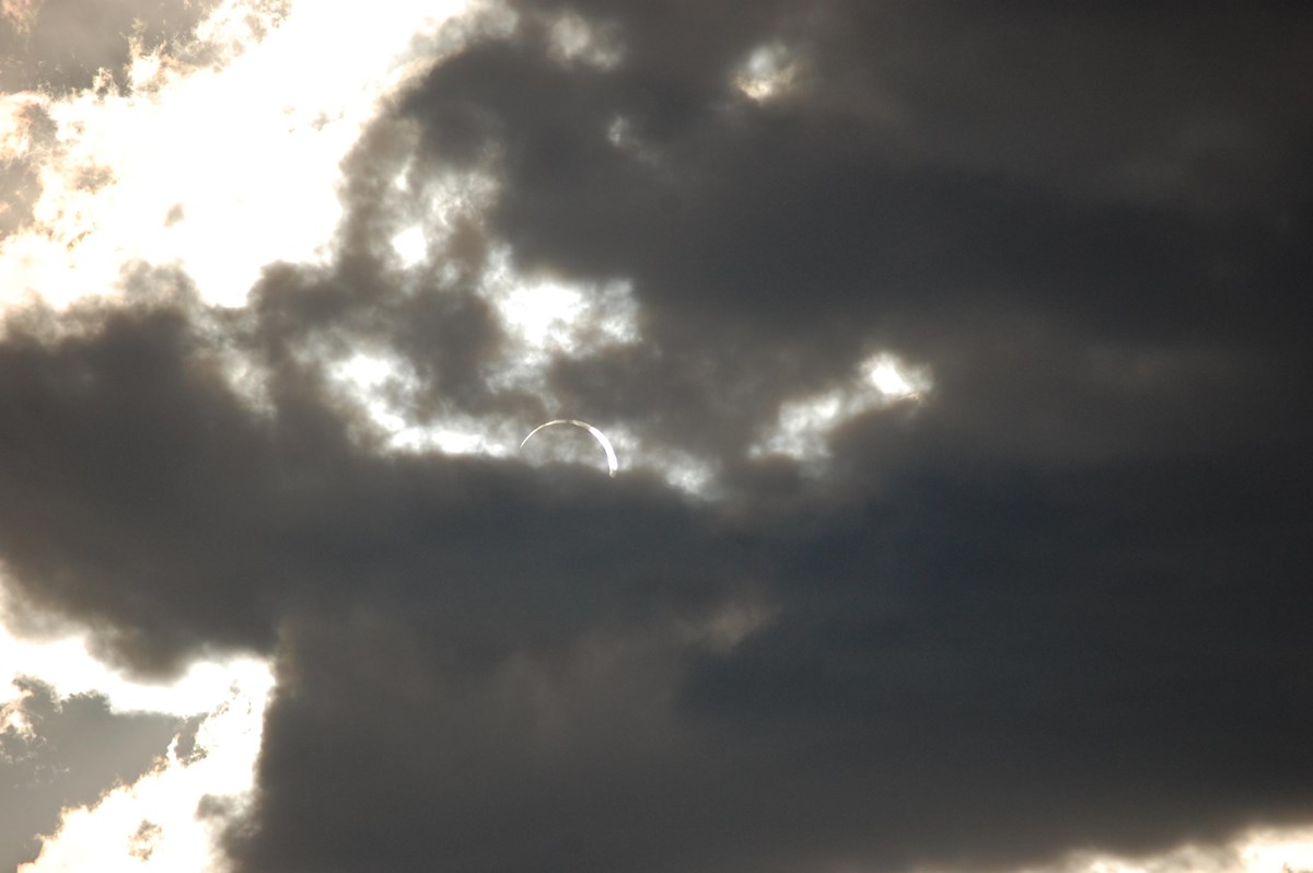 Moon passing in front of sun, creating a ring of the sun around the moon.