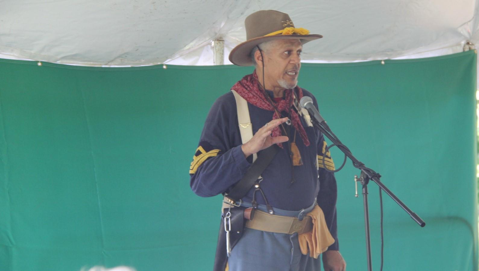 A man dressed in a historic period military uniform.