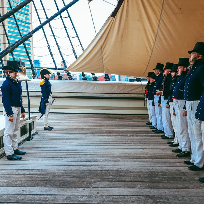 Living history sailors assembled on deck of USS Constellation