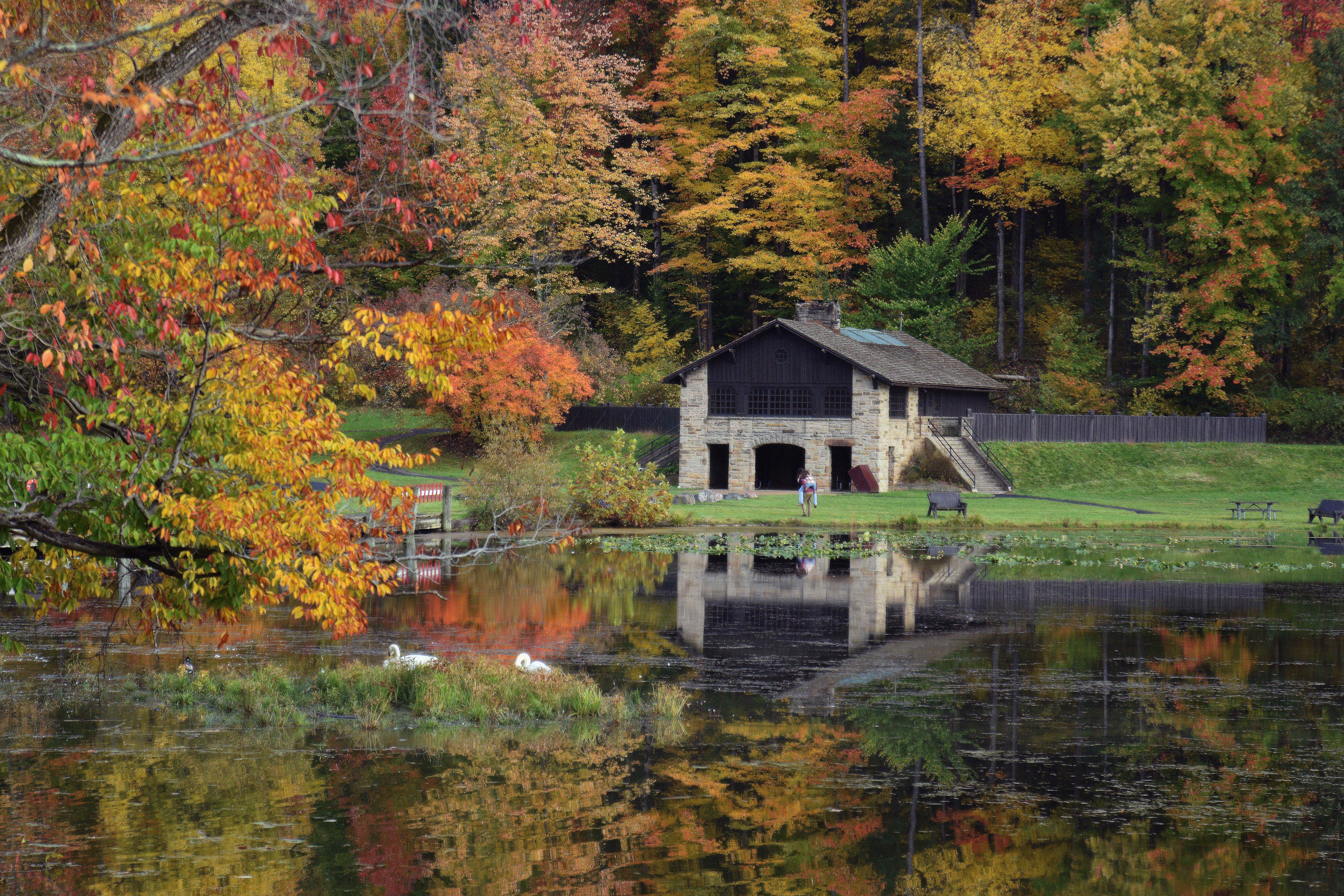 Kendall Shelter and the surrounding fall foliage reflect off the glassy surface of Kendall Lake.
