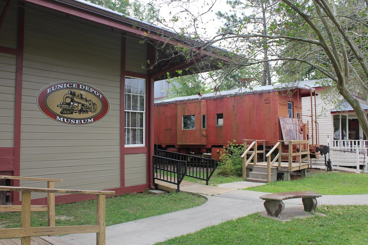 The Depot Museum in Eunice LA with a train car in the background