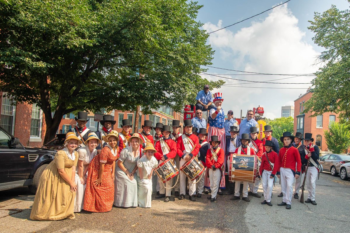 Living history volunteers in War of 1812 uniforms and clothing at Federal Hill