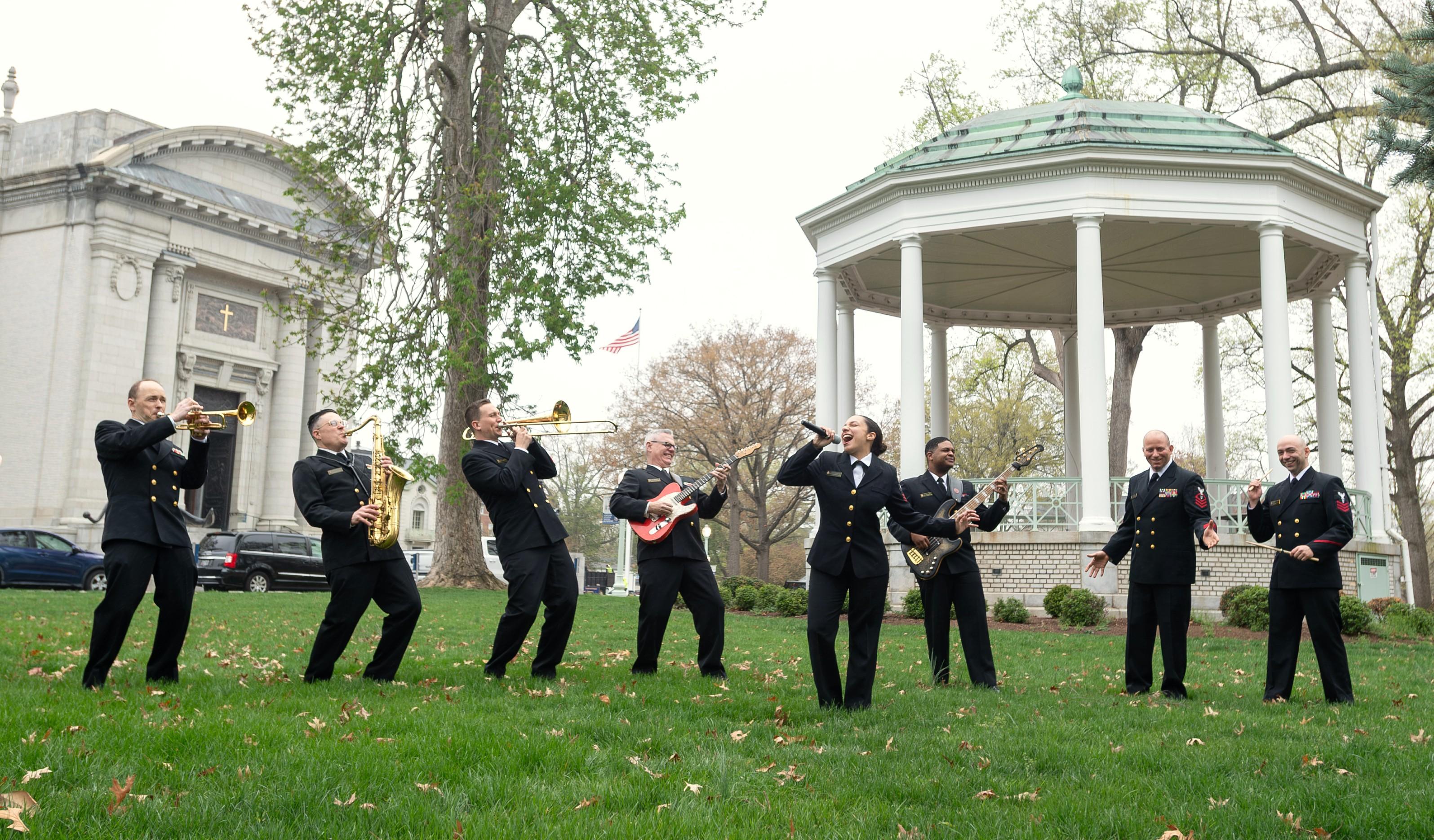 Naval Academy Band&rsquo;s Electric Brigade playing music outside.