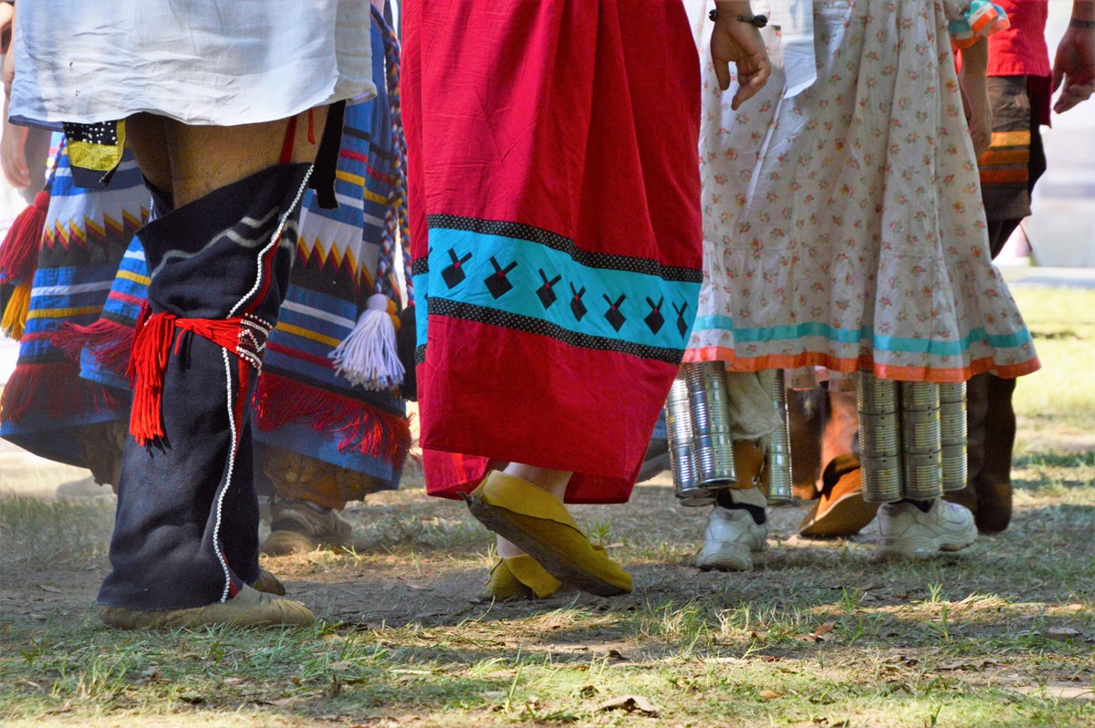 A close-up photo of Muscogee citizens' feet as they dance in a circle.