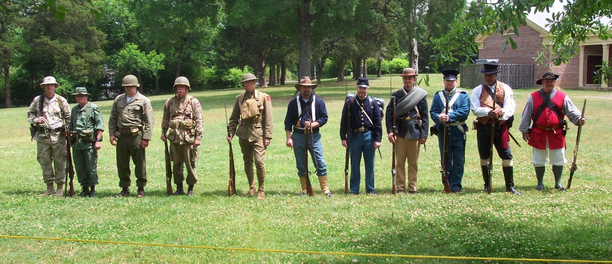 Living historians dressed as soldiers through history.