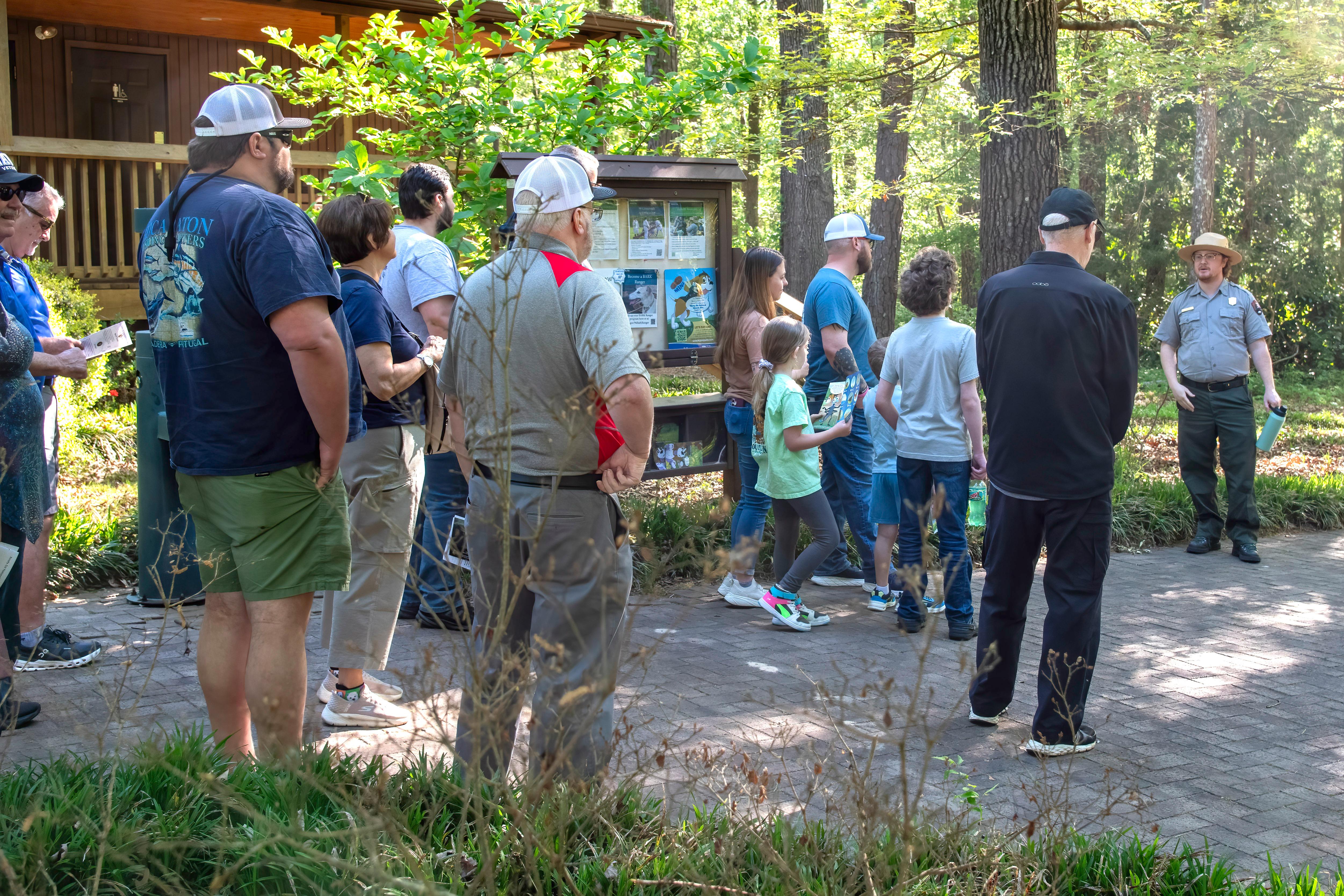 Visitors gathered along the trail with a park ranger to start a tour.