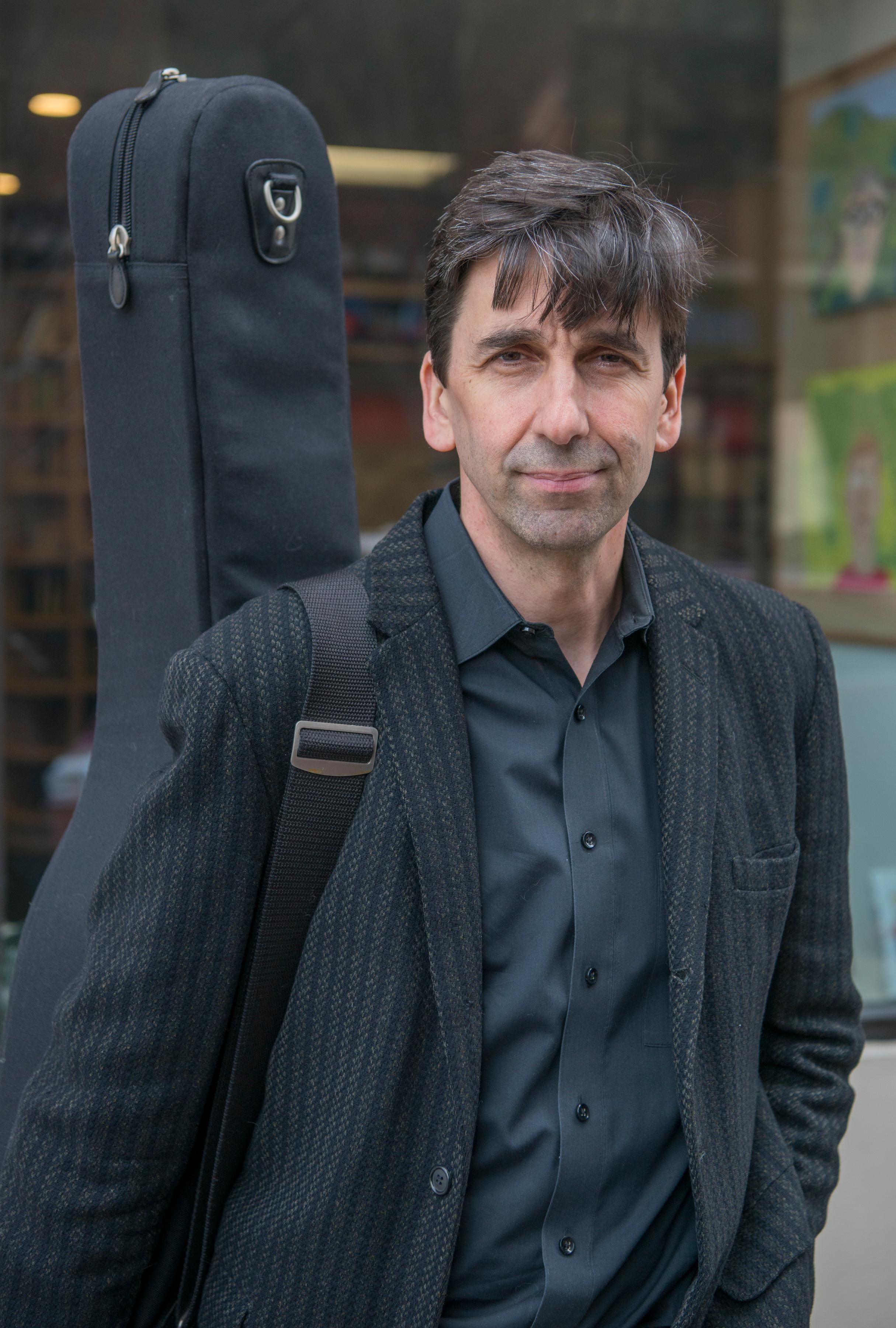 Pete Smith with guitar case