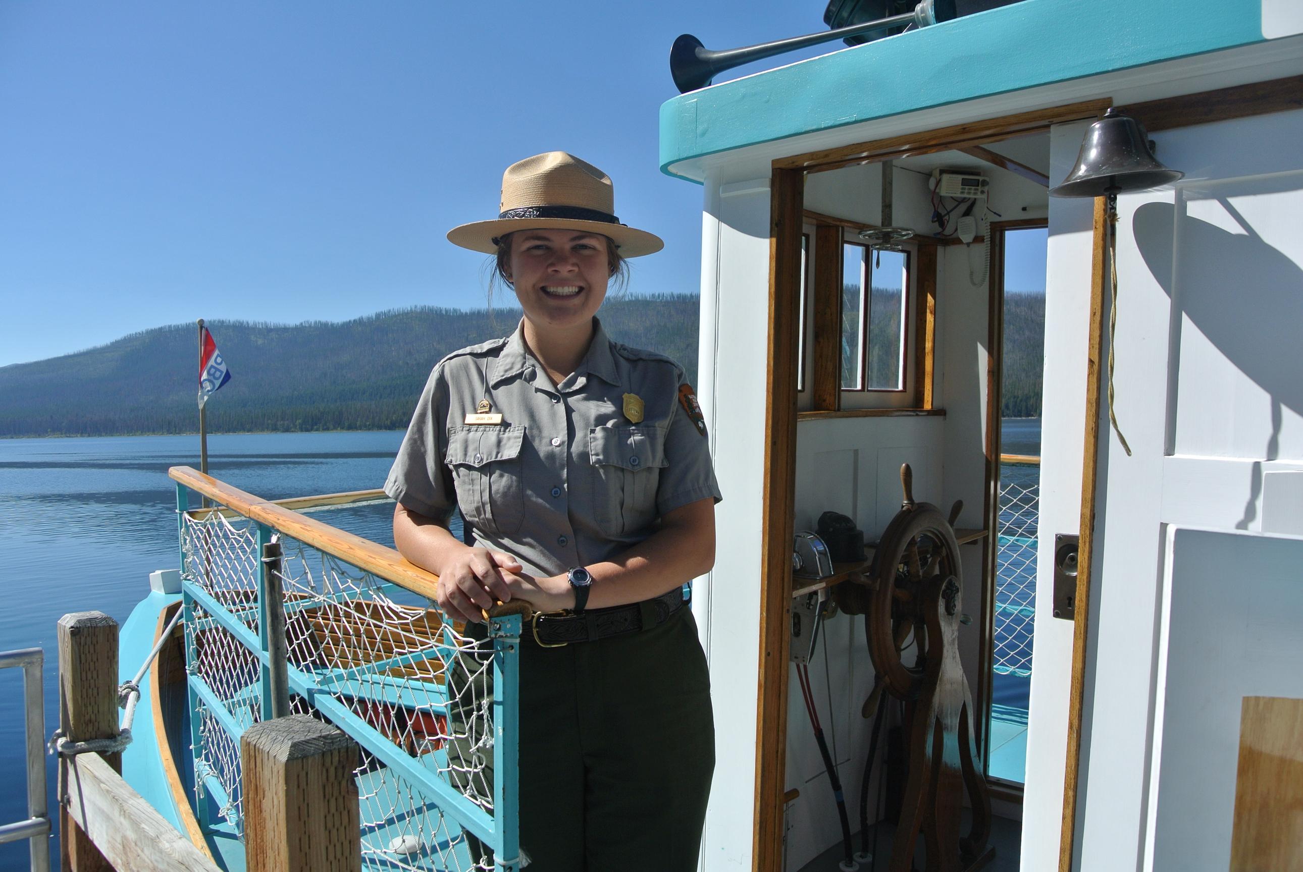 Park ranger aboard a boat.