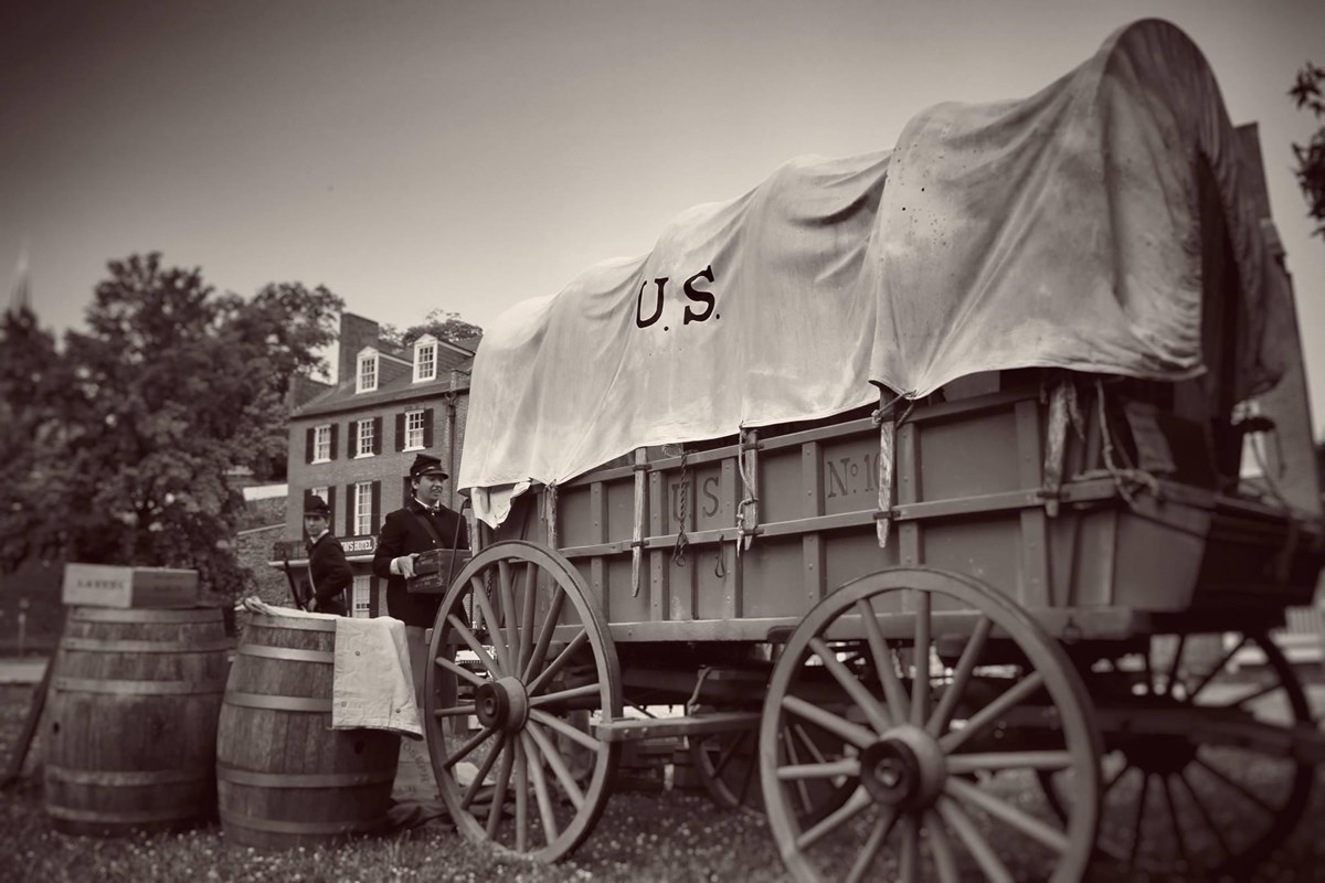 Covered wagon labeled U.S.