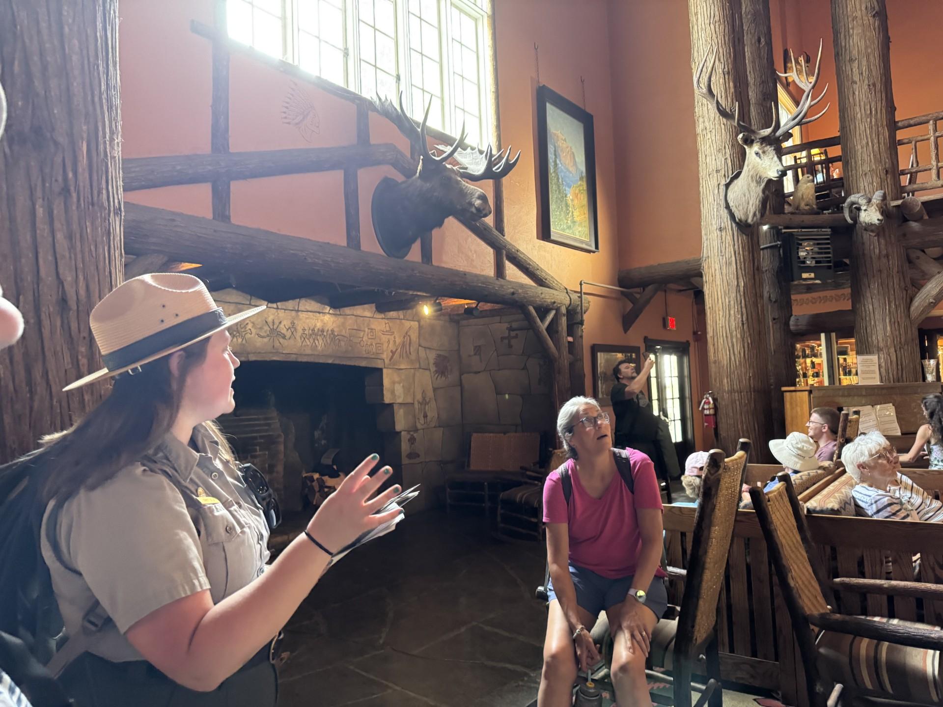 A park ranger talking in a historic lodge.