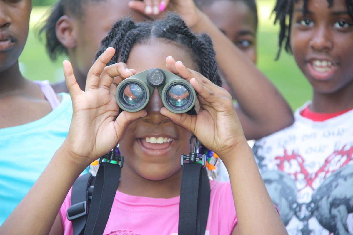 Kids with binoculars at Fort Dupont