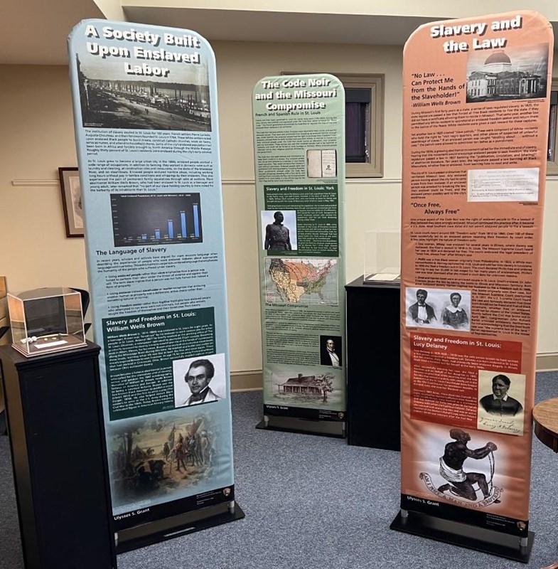 photo of 3 tall exhibit panels with images and pictures