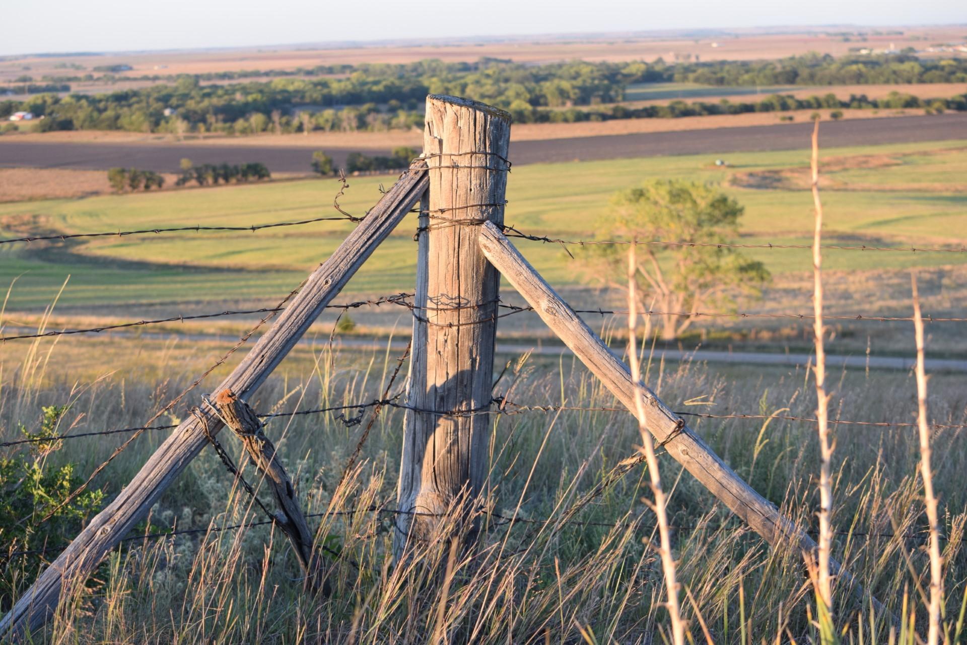 Corner post overlooking tallgrass prairie.