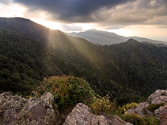 Rays of sunshine fall over the mountains in a sunset view from the bunion. Rays of sunshine fall over the mountains in a sunset view from the bunion.