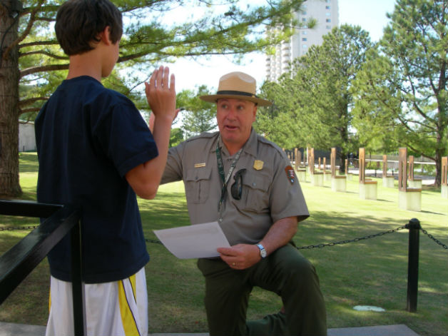 A child being sworn in as a Junior Ranger, by a National Park Service Ranger. A child being sworn in as a Junior Ranger, by a National Park Service Ranger.