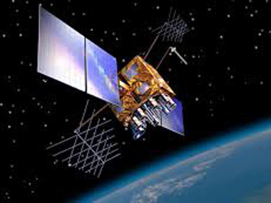 A satellite orbits the earth in space A satellite orbits the earth in space